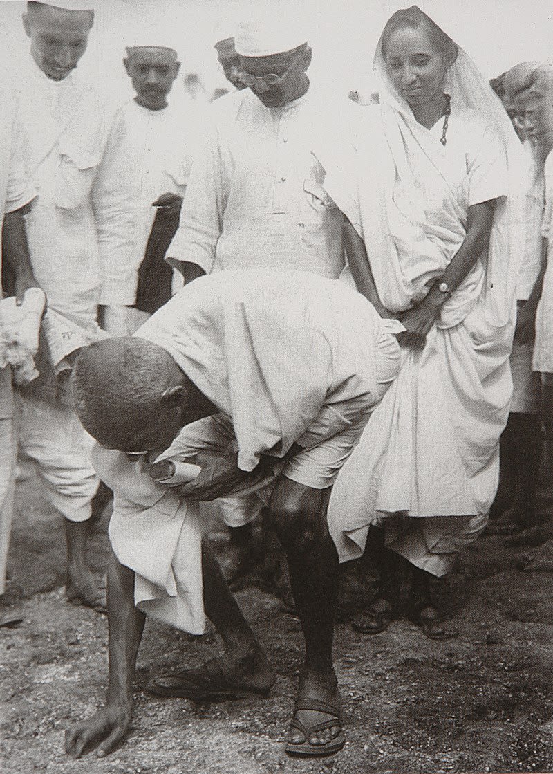 Picture of Mahatma Gandhi gathering salt